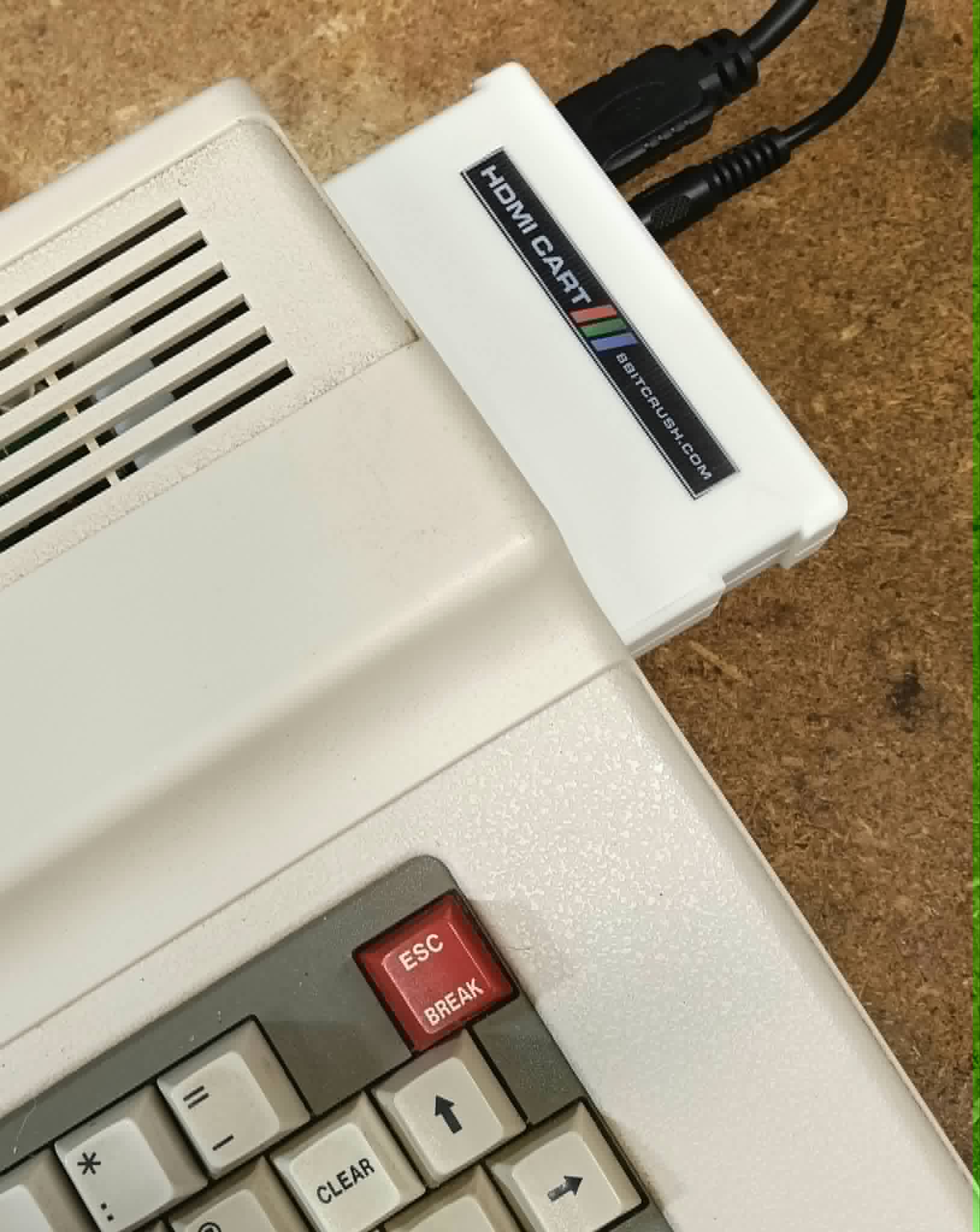 HDMI Cart plugged directly into a Tandy Colour Computer 3, with HDMI and audio cables attached