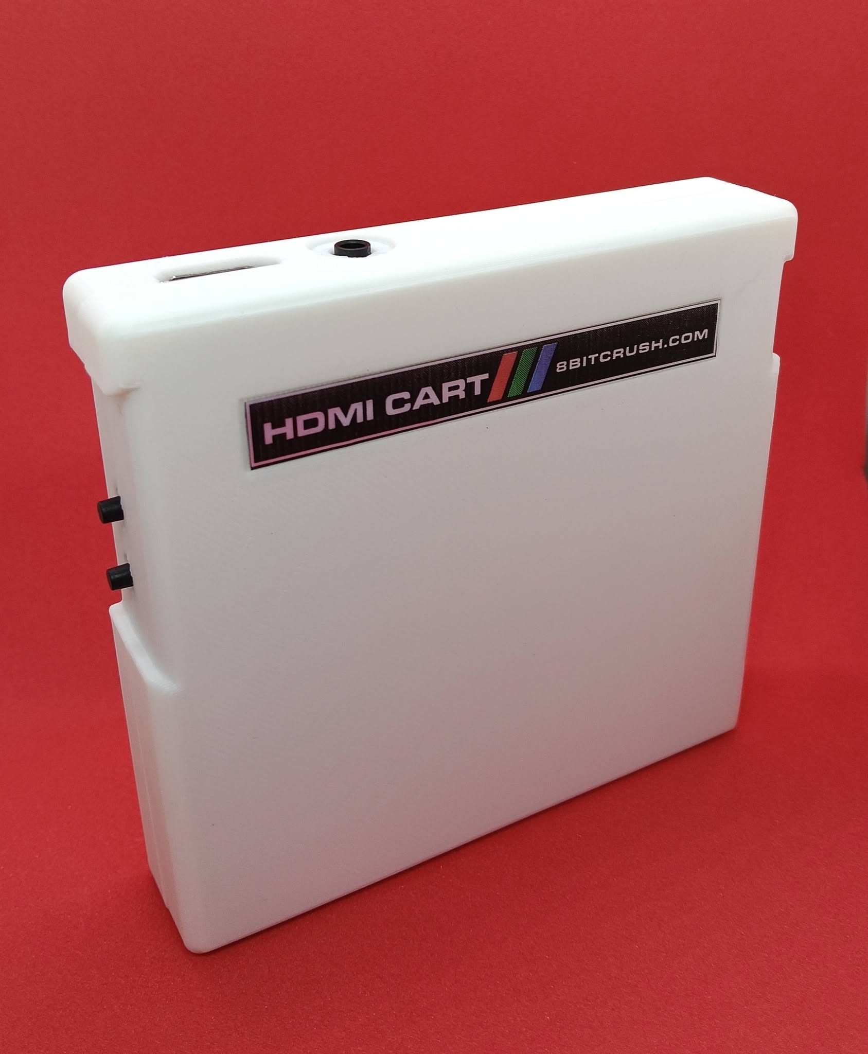 White 8BITCRUSH HDMI Cart showing the label, HDMI port, 3.5mm audio jack, and two toggle buttons