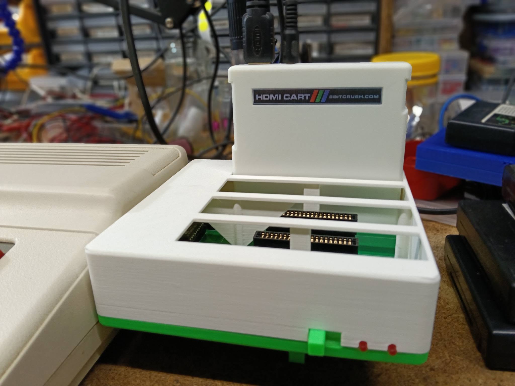 HDMI Cart plugged into an 8BITCRUSH Multipak beside a Tandy Colour Computer, with an HDMI cable attached