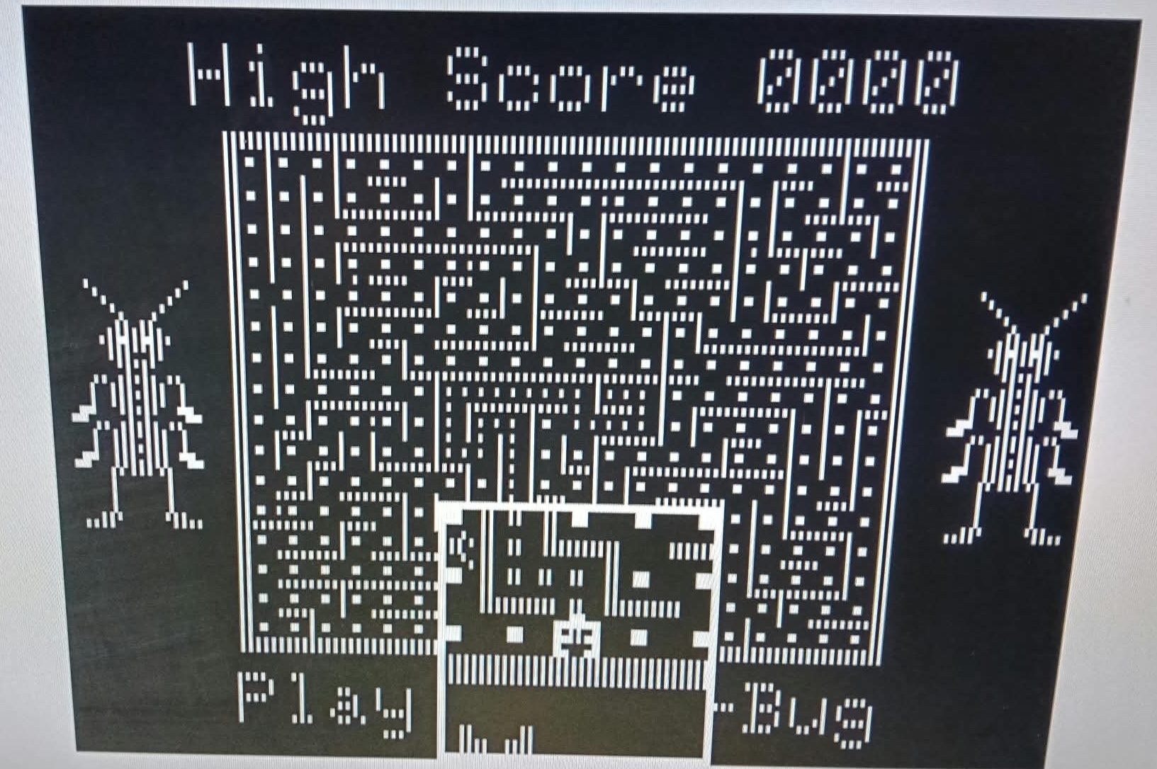 Mega-Bug title screen in black and white with colour artifacting off
