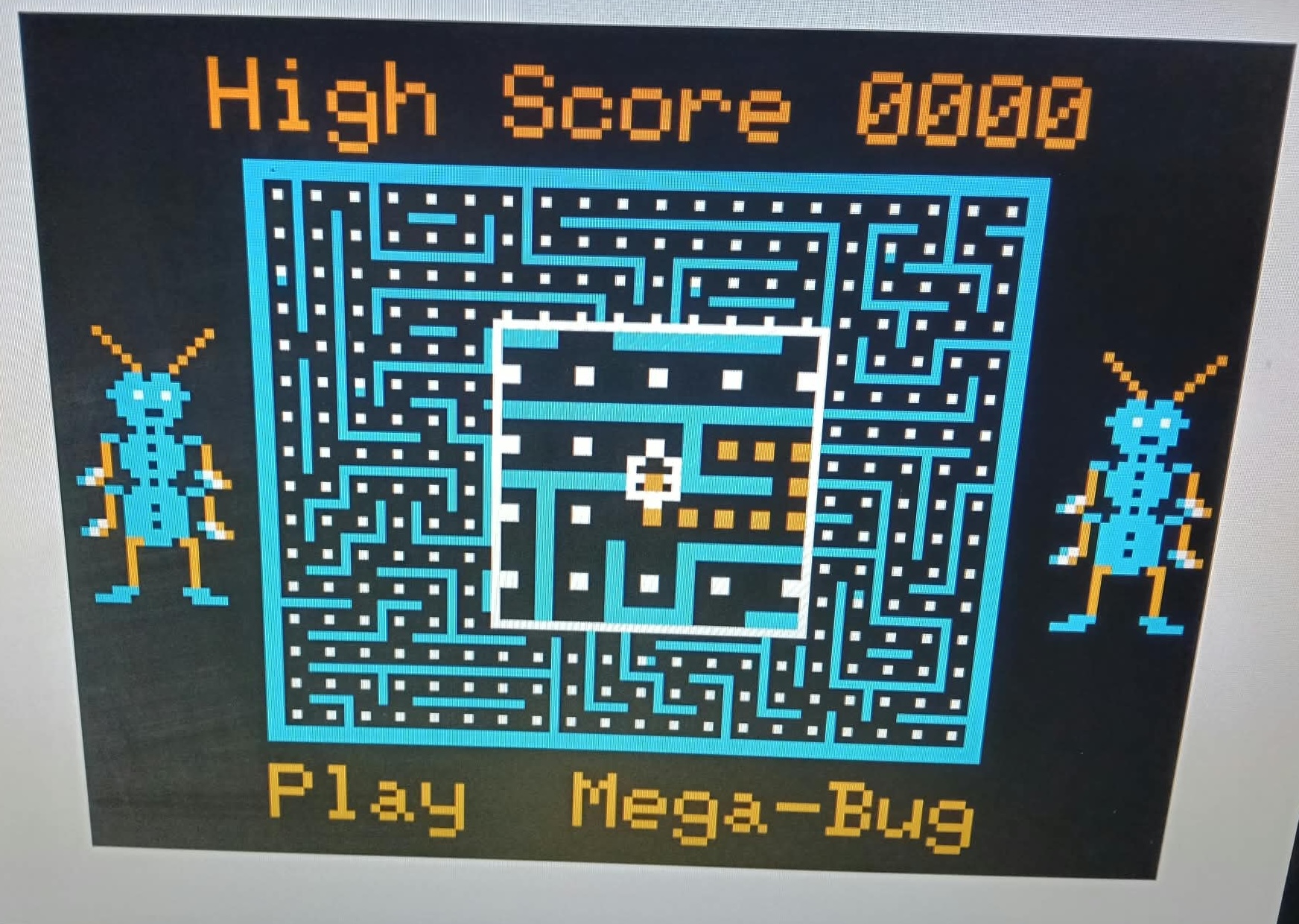 Mega-Bug title screen with emulated NTSC artifact colours, cyan maze and orange score